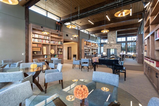 100 Woodlands Way Unit P-204, Kalispell, MT 59901 - interior space with a towering ceiling, beam ceiling, wooden ceiling, and a fireplace