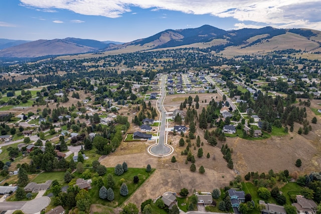 birds eye view of property featuring a mountain view