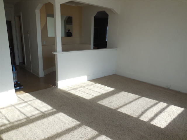 unfurnished room featuring carpet floors