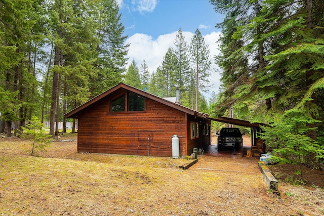 view of property exterior with a carport