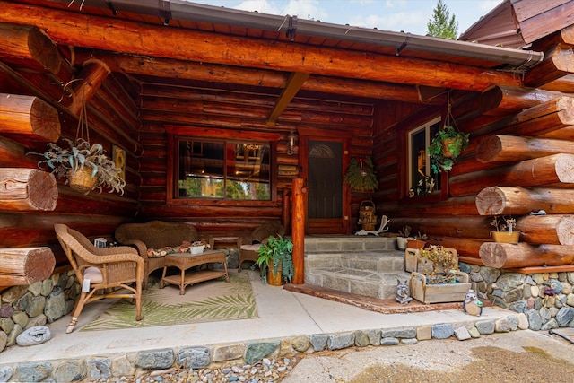 entrance to property with a patio