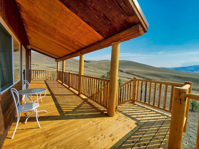 wooden terrace featuring a mountain view