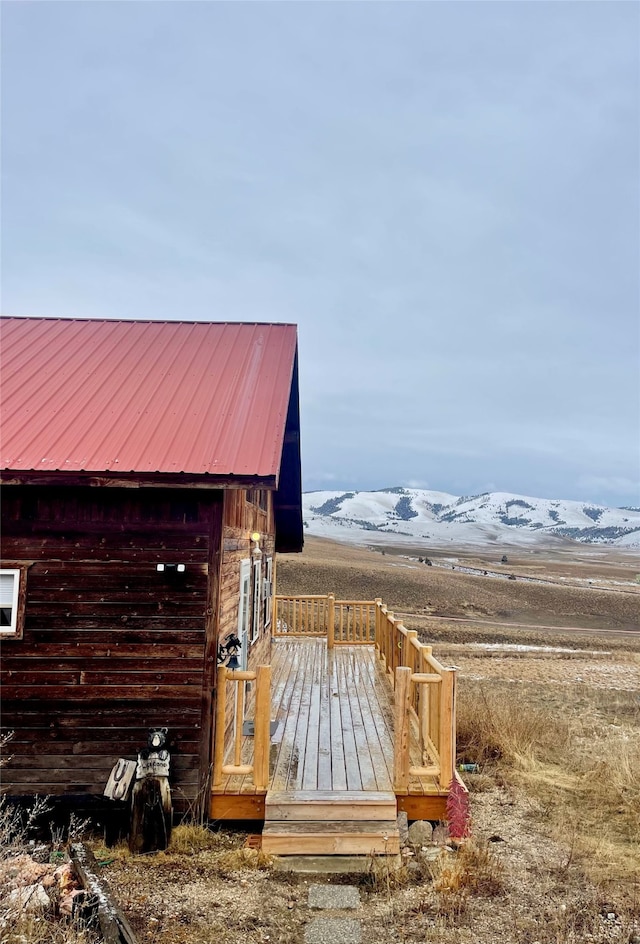 exterior space featuring a mountain view and an outdoor structure