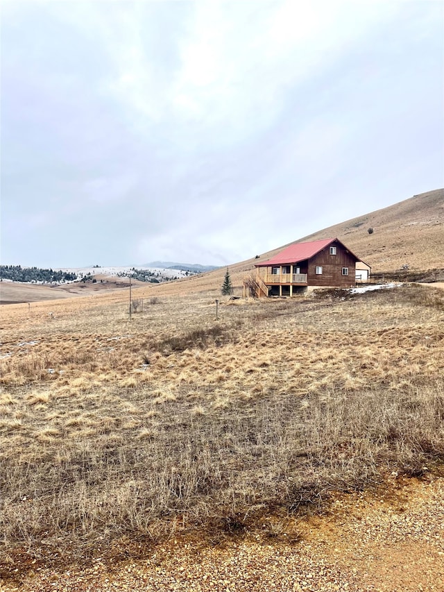 view of yard with a rural view