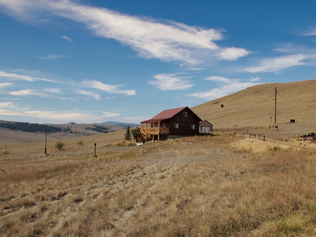 view of yard featuring a mountain view and a rural view