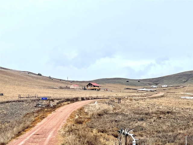 property view of mountains featuring a rural view