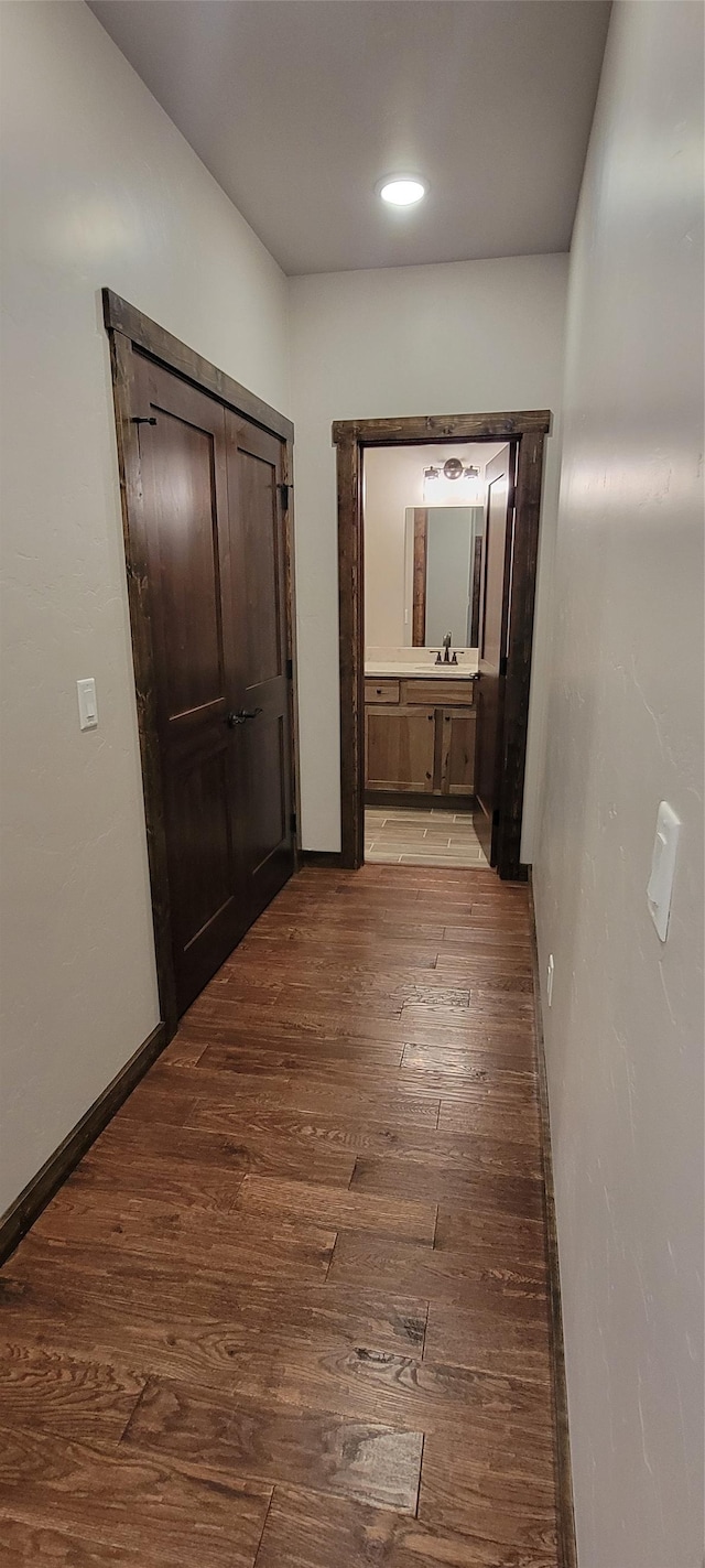 corridor with light wood-type flooring