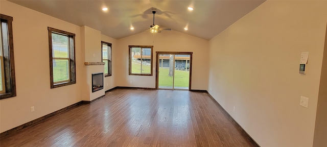 empty room with dark hardwood / wood-style floors, ceiling fan, and lofted ceiling