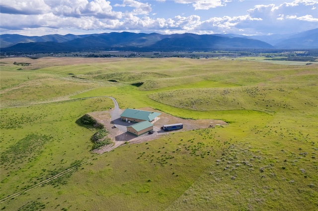 back of house featuring a mountain view and french doors