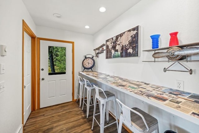 interior space with wood finished floors and recessed lighting