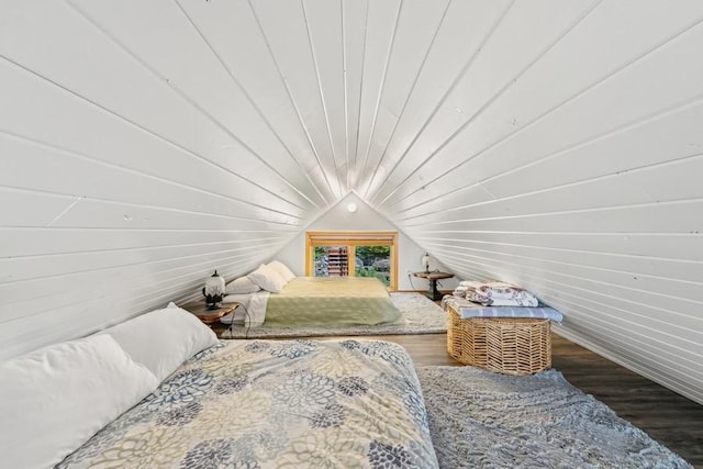 bedroom featuring lofted ceiling, wood walls, wooden ceiling, and wood finished floors