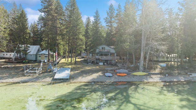 view of yard featuring a deck with water view