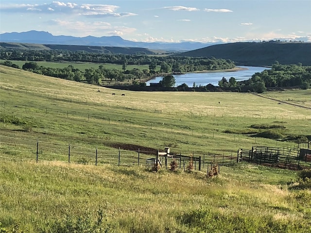 mountain view with a rural view and a water view