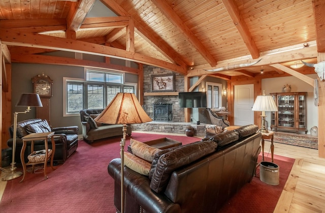 living room featuring high vaulted ceiling, beamed ceiling, wood-type flooring, a fireplace, and wood ceiling