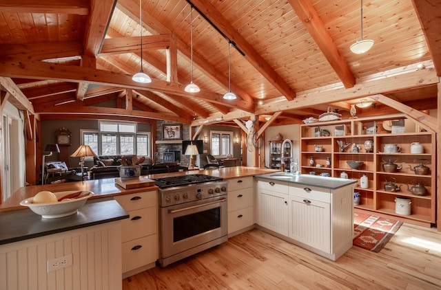 kitchen featuring white cabinetry, hanging light fixtures, wooden ceiling, light hardwood / wood-style flooring, and high end range