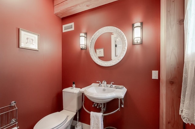 bathroom with toilet and sink