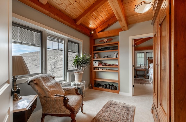 living area featuring lofted ceiling with beams, light colored carpet, and wood ceiling