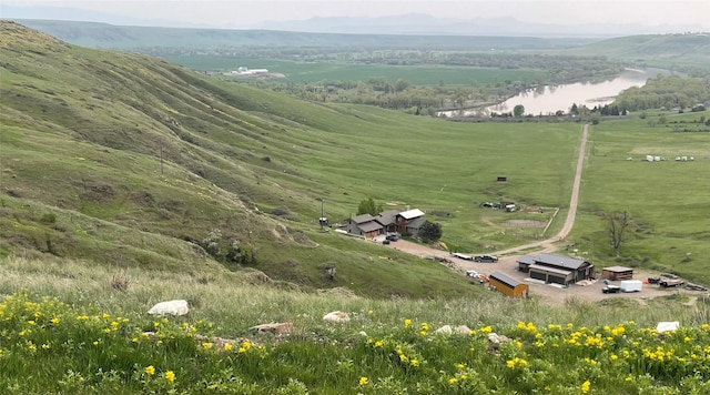 bird's eye view featuring a rural view and a water and mountain view