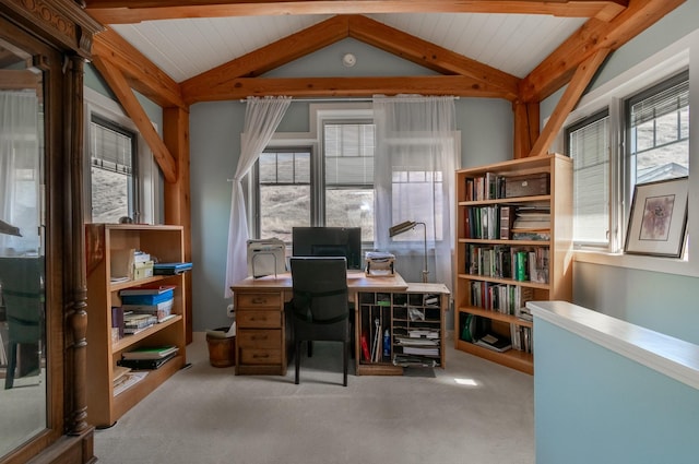 carpeted office space featuring lofted ceiling with beams