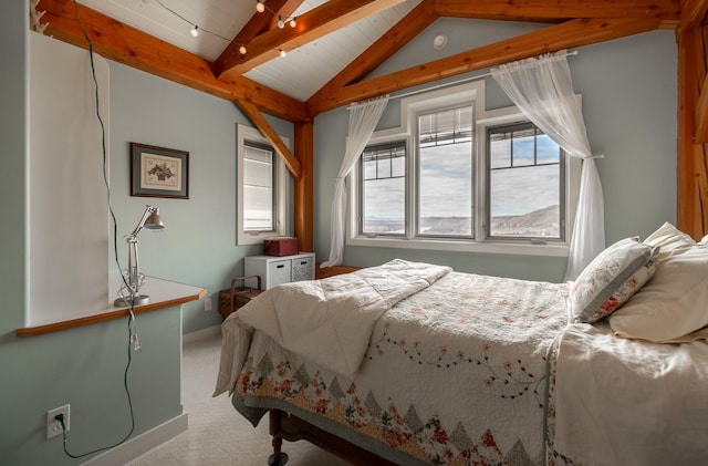 carpeted bedroom with lofted ceiling with beams