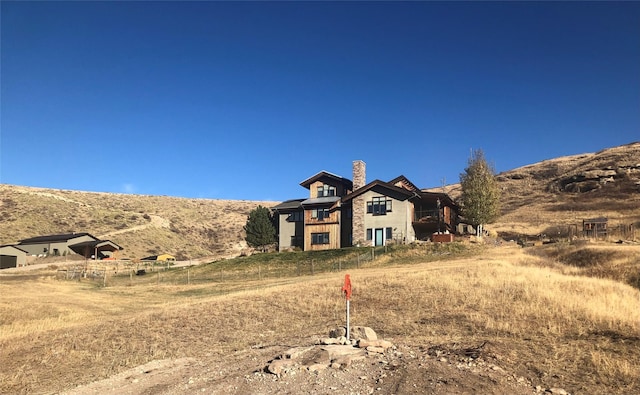 view of front of home with a mountain view