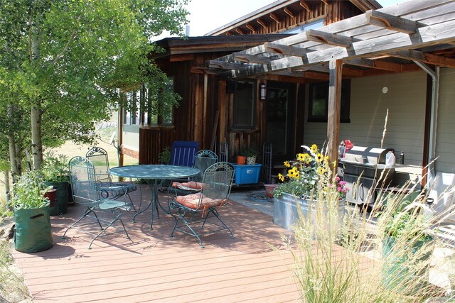 wooden deck with a pergola