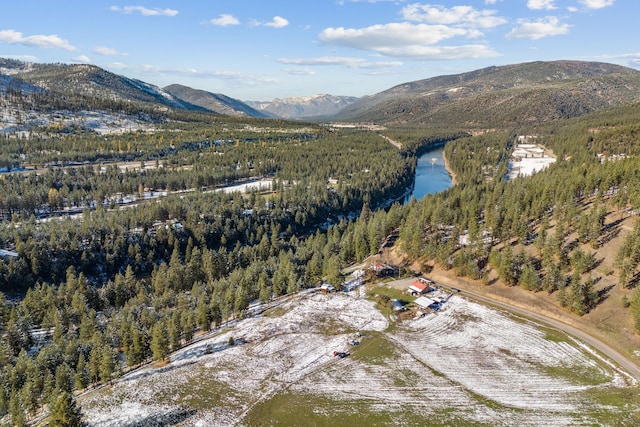 drone / aerial view featuring a water and mountain view