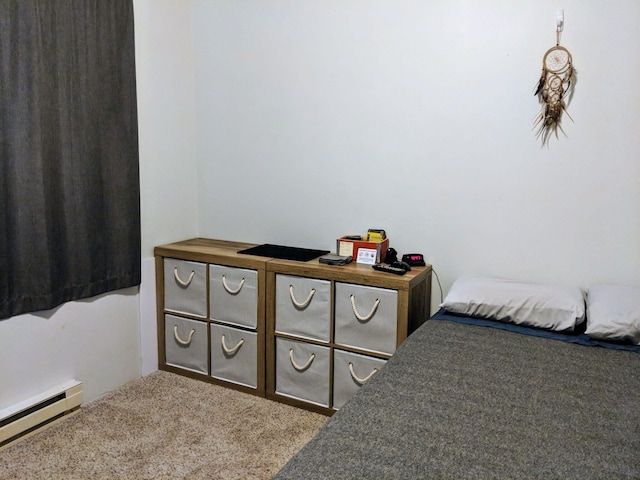 carpeted bedroom with a baseboard radiator