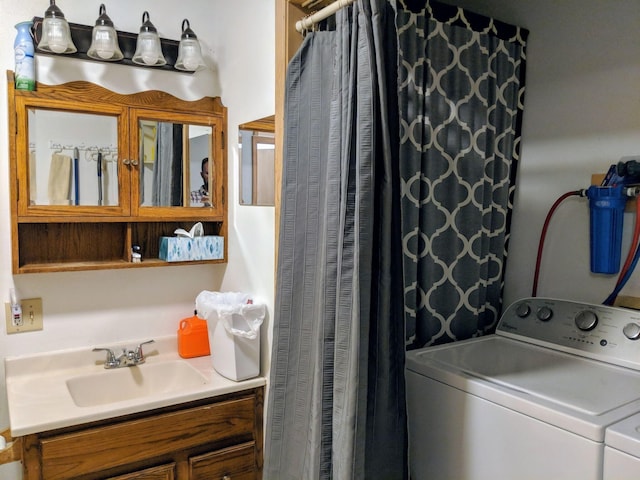 laundry area with sink and separate washer and dryer