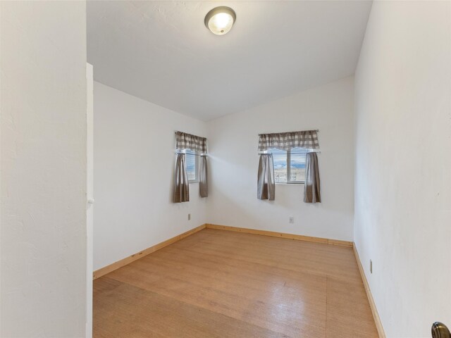 spare room featuring light hardwood / wood-style flooring