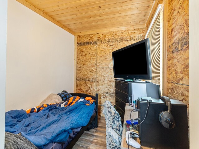 bedroom featuring dark wood-type flooring and wooden ceiling