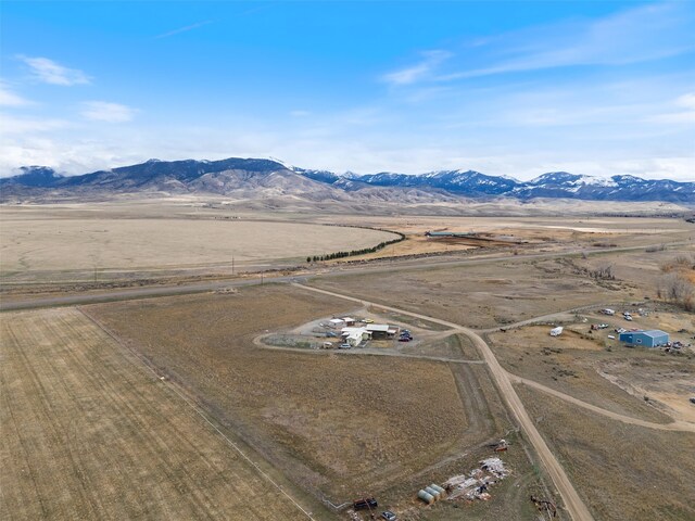 drone / aerial view featuring a mountain view and a rural view