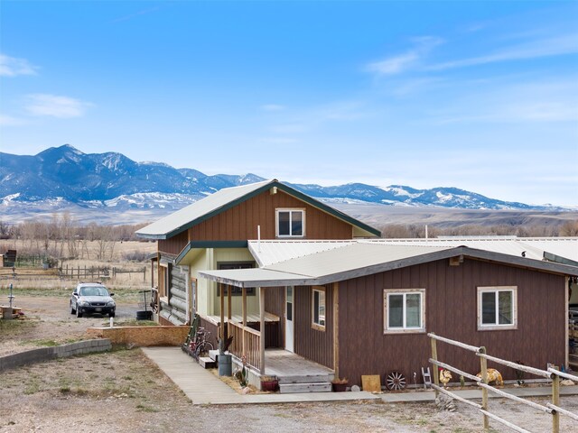 view of front of property featuring a mountain view and covered porch