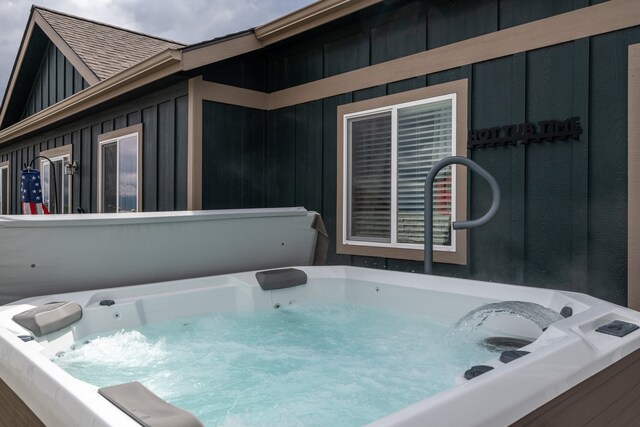 exterior space featuring a hot tub