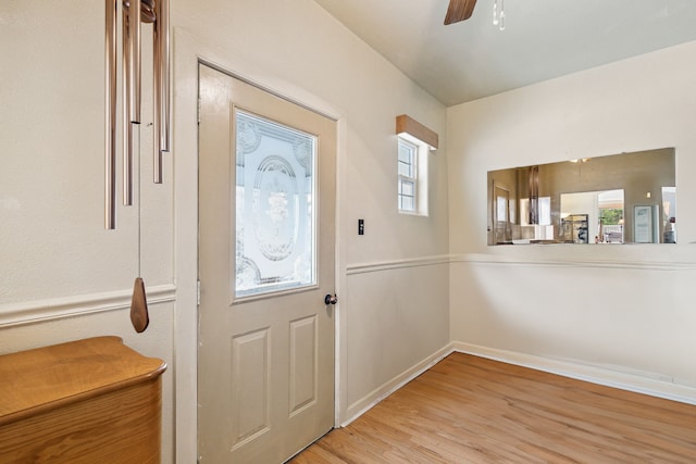entrance foyer featuring light wood-type flooring, baseboards, and ceiling fan