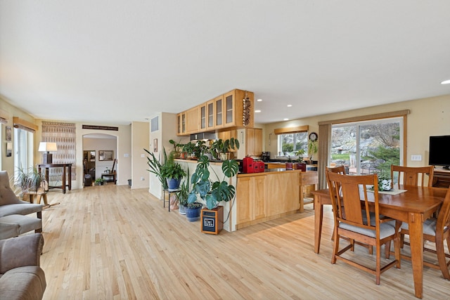 dining area featuring light wood-type flooring