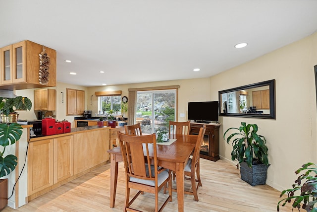 dining area featuring light wood-type flooring