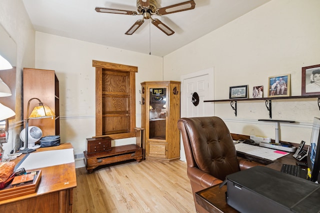 home office with vaulted ceiling, wood finished floors, and ceiling fan