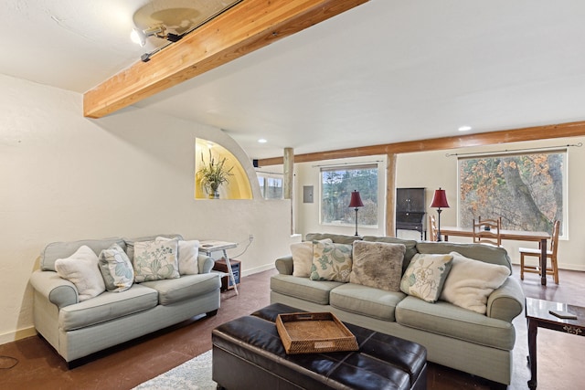 living room featuring beamed ceiling, baseboards, and recessed lighting