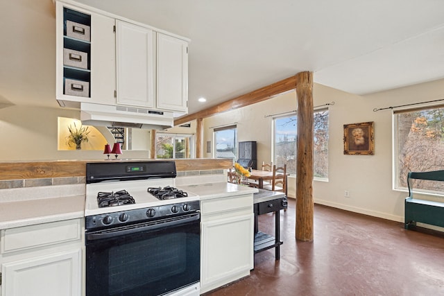 kitchen featuring white cabinetry, a wealth of natural light, and white gas range oven