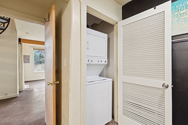 laundry room featuring stacked washing maching and dryer