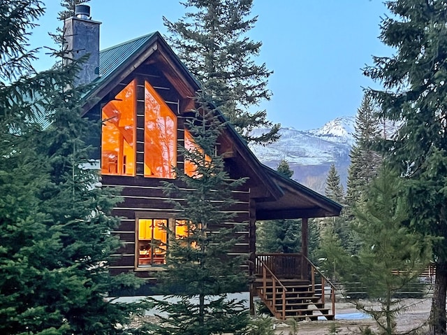 view of side of home featuring a mountain view