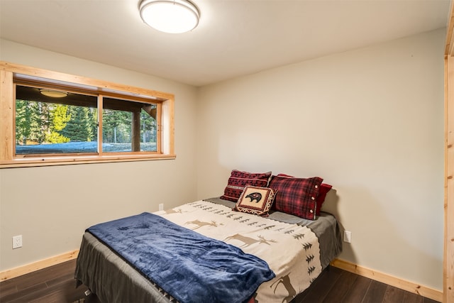 bedroom featuring dark wood-type flooring