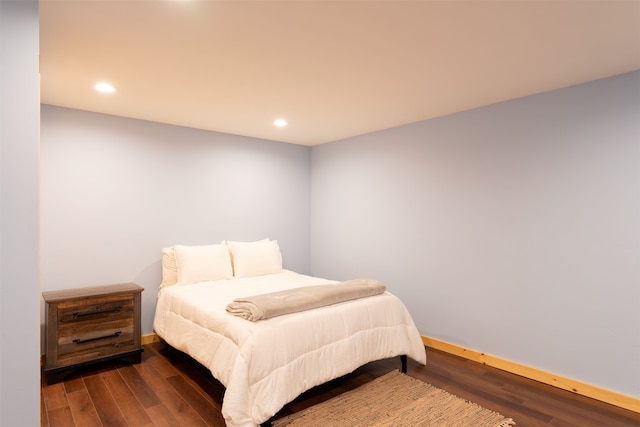 bedroom featuring dark wood-type flooring