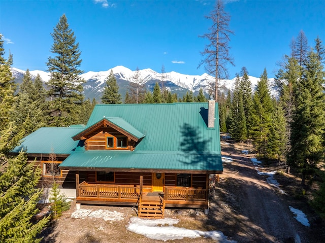 log cabin with a mountain view