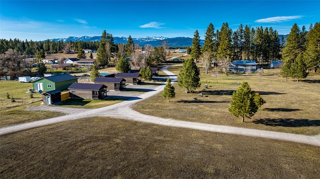 view of property's community with a yard and a mountain view