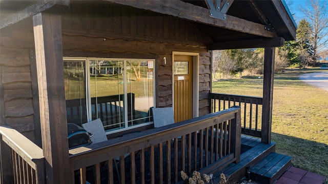 wooden deck with a lawn