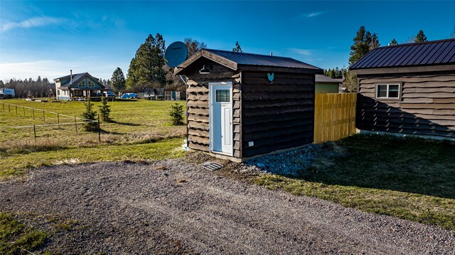 view of shed / structure featuring a yard