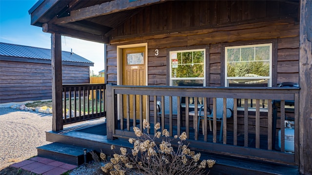 doorway to property featuring a deck