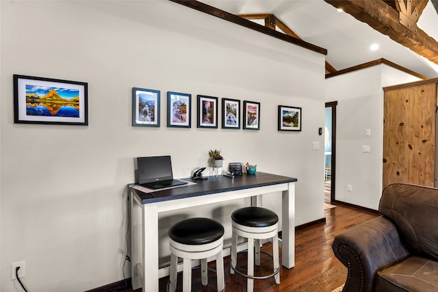 office with dark hardwood / wood-style floors and vaulted ceiling with beams